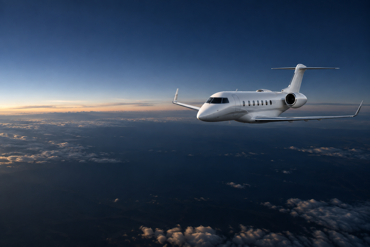 Unbranded business aircraft in flight above a cloud layer